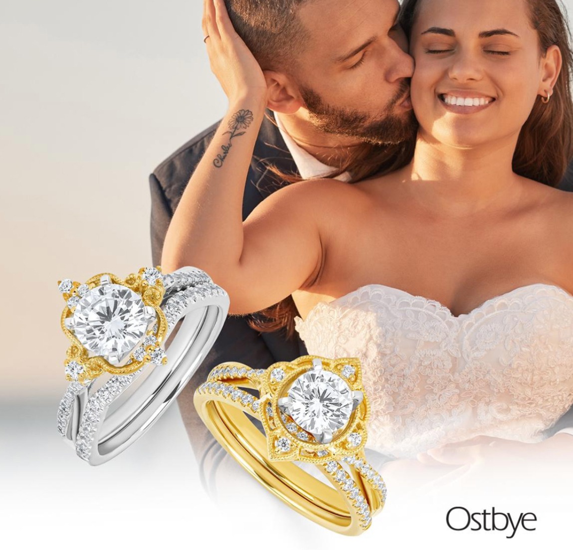 A couple embraces, sharing a kiss, with elegant wedding rings showcased in the foreground