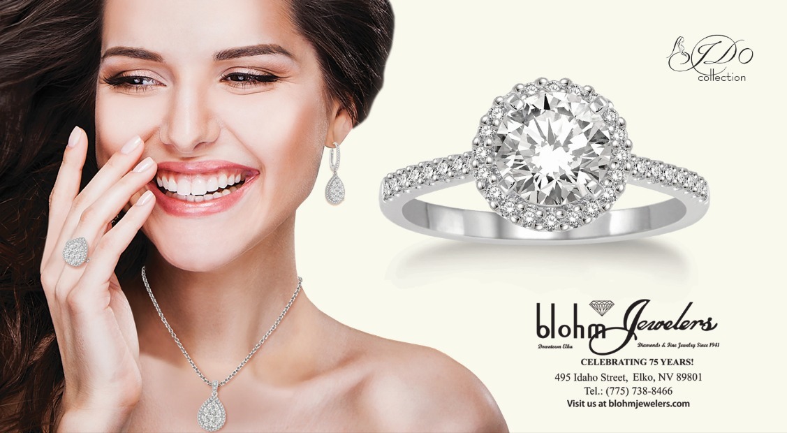 A smiling woman showcases stunning jewelry